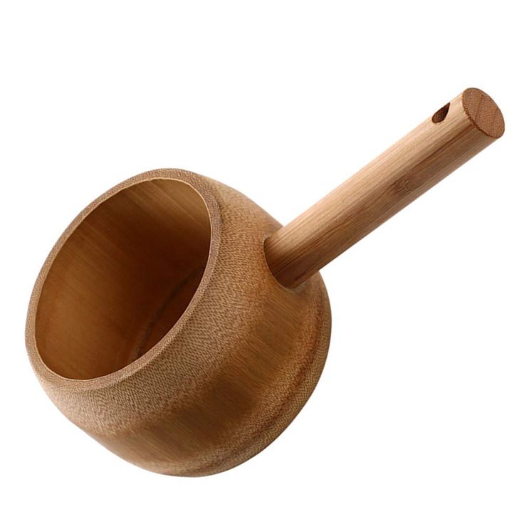 a wooden mortar and pestle on a white background