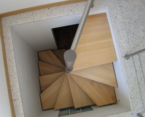 an overhead view of a spiral staircase in a building