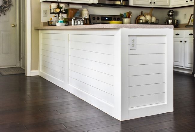 a kitchen with white cabinets and wood floors is pictured in this image from the inside