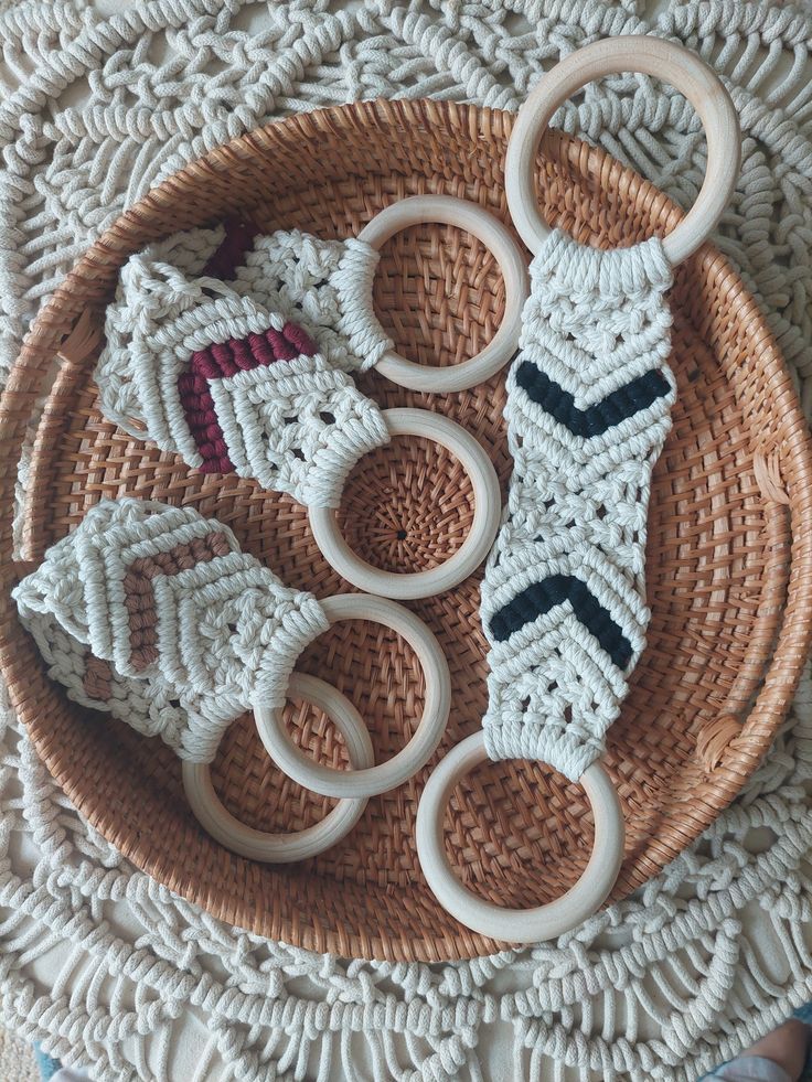 three crocheted rings sitting on top of a woven basket