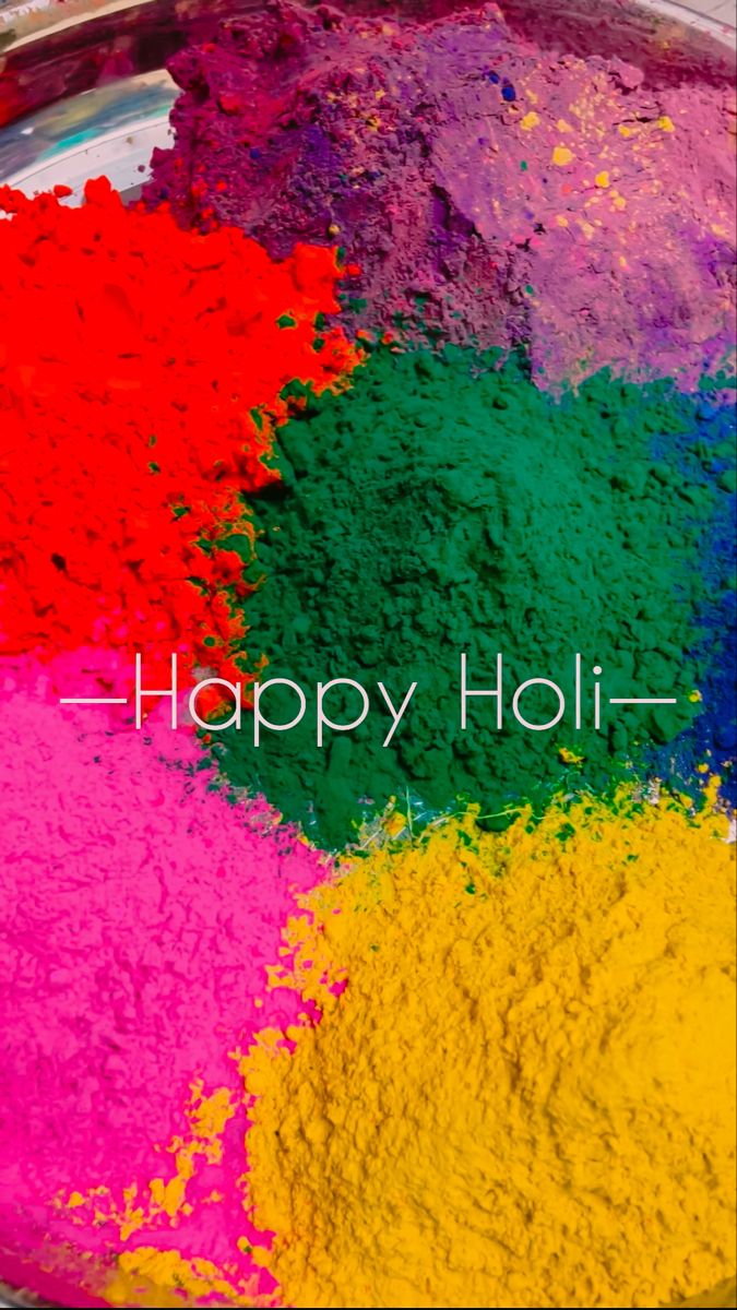 colorful powdered food with the words happy holi on it