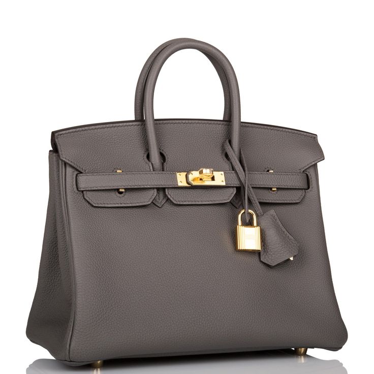 This Birkin is in Etain togo leather with gold hardware and has tonal stitching, two straps with front toggle closure, clochette with lock and two keys and double rolled handles.   The interior is lined with Etain chevre and has one zip pocket with an Hermes engraved zipper pull and an open pocket on the opposite side.   Collection: ZOrigin: FranceCondition: Pristine; new or never  (plastic on hardware)Accompanied by: Hermes box, Hermes dustbag, clochette, lock, two keys, clochette dustbag, rainhat, carebook, ribbon and felt Measurements: 10" width x 7.5" height x 4.75" depth; 2.75" handle drop Hermes Birkin 25, Hermes Box, Togo Leather, Birkin 25, Hermes Bags, Hermes Birkin, Brunei, New Bag, Birkin Bag