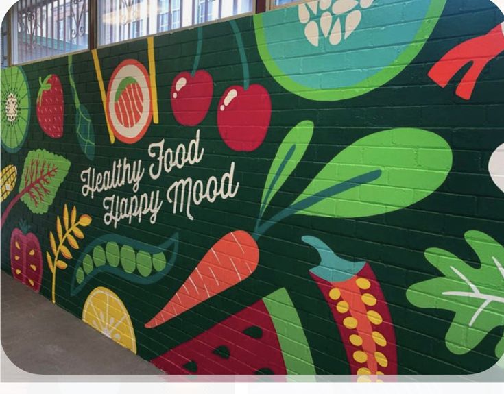 a mural painted on the side of a building with words healthy food is simply mood