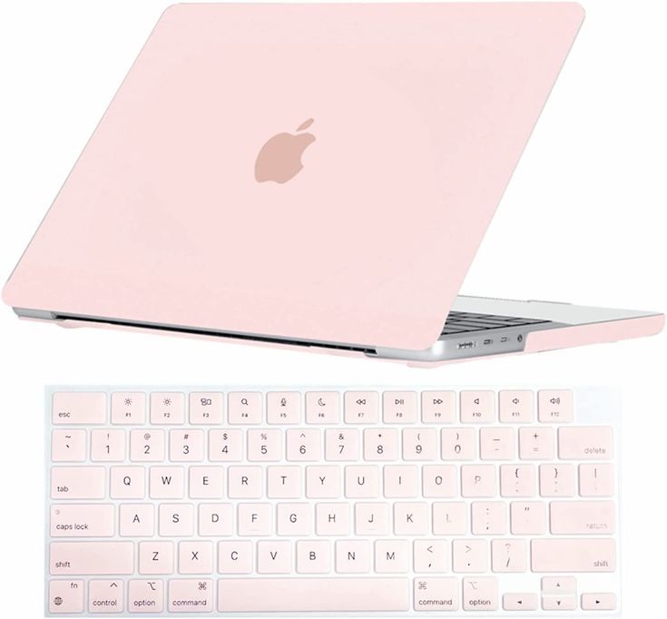 an apple laptop computer sitting on top of a white keyboard next to a pink macbook pro