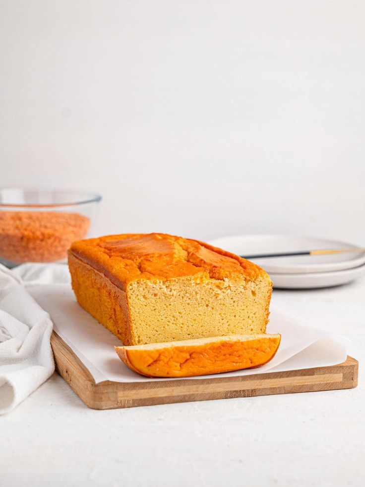 a loaf of bread sitting on top of a cutting board