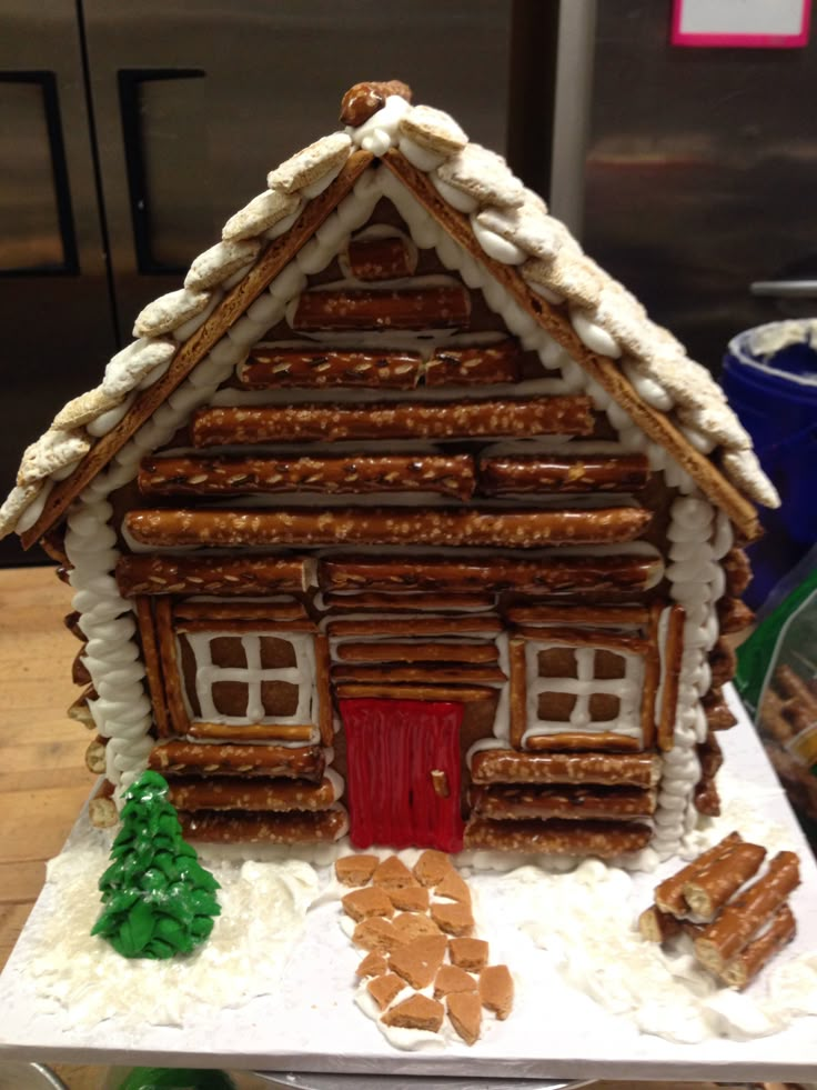 a gingerbread house made to look like a log cabin