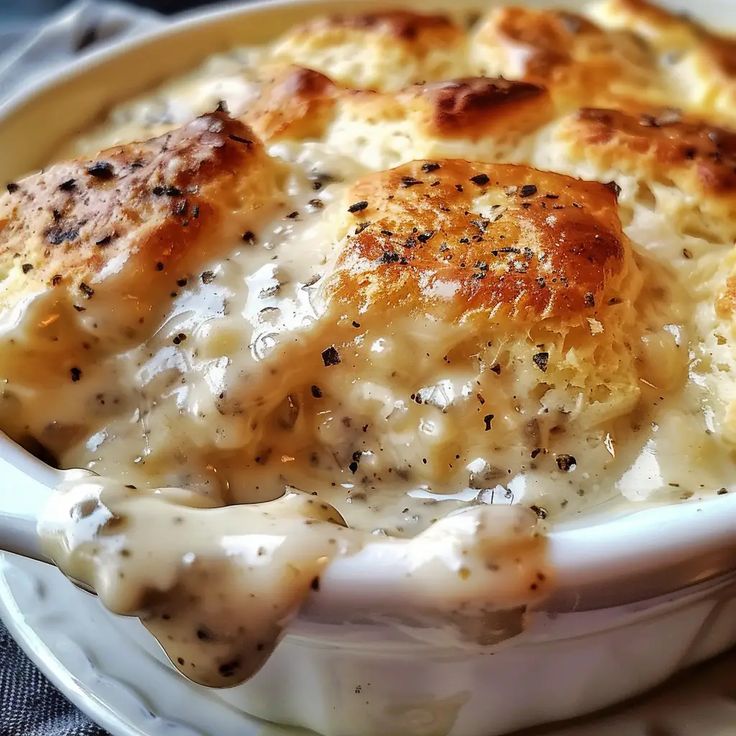 a white bowl filled with cheese and sauce