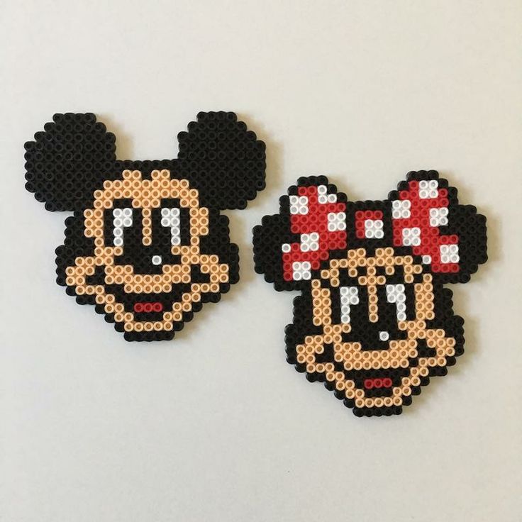 two mickey and minnie mouse magnets made out of perler beads