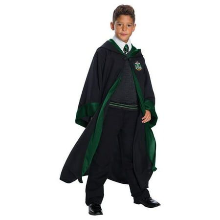 a young boy dressed up in a harry potter robe and hat, standing with his hands on his hips