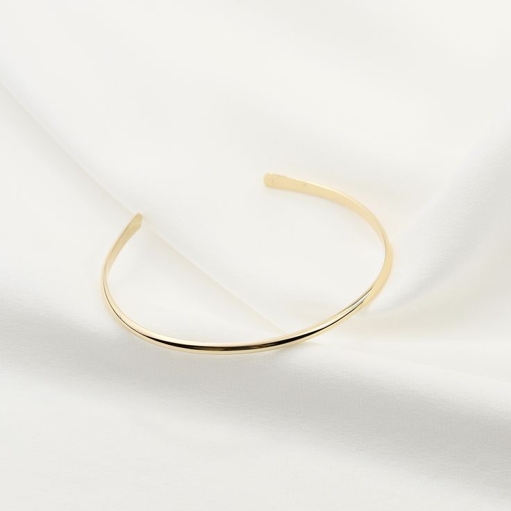 "14K gold cuff bracelet. 14K Gold Minimalist Cuff Bracelet, Delicate cuff bracelet. The bracelet will be shipped in a gift box * 14K solid gold. It is about 2.5mm width. Please select the size of your wrist. If your wrist is 6\", please purchase a 6\" bracelet. (If you order a 6\" bracelet, actual cuff length will be 5\" plus 1 inch opening.) Please read our policies before you place your order. https://www.etsy.com/shop/SashJewelry/policy?ref=shopinfo_policies_leftnav To see other Mother daught Elegant Gold Bracelet With Open Band, Adjustable Gold Cuff Bracelet For Everyday Luxury, Elegant Gold Open Band Bangle, Gold Open Band Bangle Gift, Gold Open Cuff Elegant Jewelry, Elegant Gold Open Cuff Jewelry, Elegant Cuff Bangle As A Gift, Modern Yellow Gold Bangle Cuff Bracelet, Elegant Open Cuff Bangle With Polished Finish