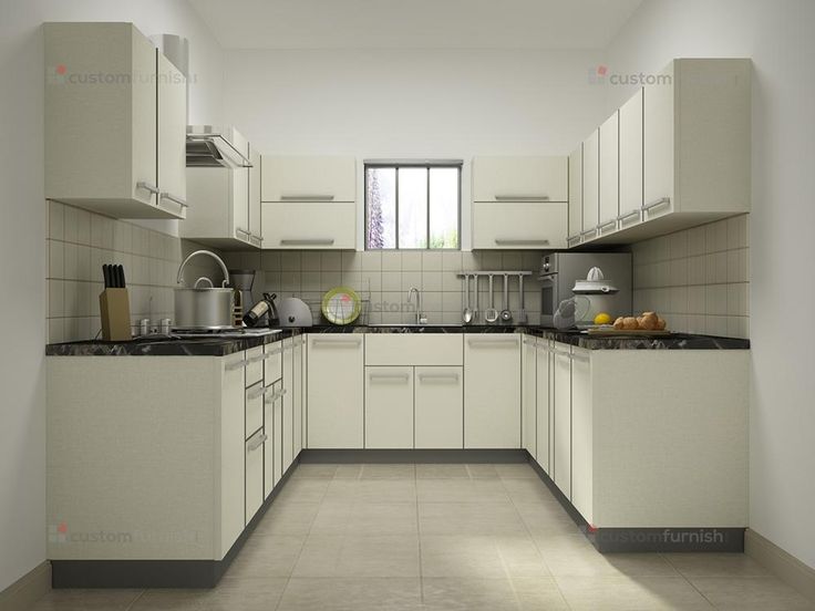 an empty kitchen with white cabinets and black counter tops is seen in this image from the front view