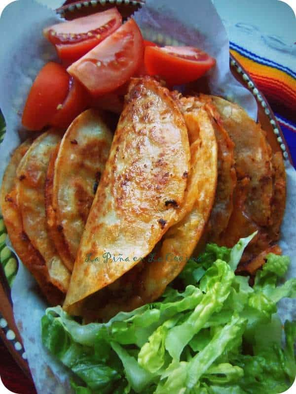 a plate with french fries, tomatoes and lettuce