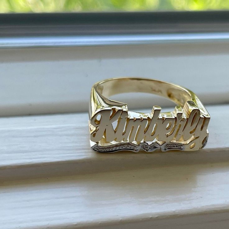 Medium Size Personalized Name Ring In Real 10K & 14K Gold *FLAT FACE * MADE IN USA (HAND MADE ITEM) Make the names of your family, friends and love ones into rings for their gift. It's great as an everyday necklace and makes an awesome gift! This Item is 100% customization especially for you. Item Description *Material: Real Gold *Type: *FLAT FACE* ( Like photo) with Heart Tail with Bit Work *Ring size: ring sizes between 1-11 (including half sizes) *Size of Ring : 20mm*8mm *Script Design *O Custom Name Plate Ring For Promise, Promise Ring With Custom Nameplate, 14k Gold Custom Name Engraved Ring For Promise, Custom Name 14k Gold Engraved Promise Ring, Custom Name Engraved 14k Gold Promise Ring, 14k Gold Engraved Ring With Custom Name For Promise, 14k Gold Engraved Name Ring For Promise, Engraved Nameplate Ring For Promise, Personalized 14k Gold Signet Ring For Anniversary