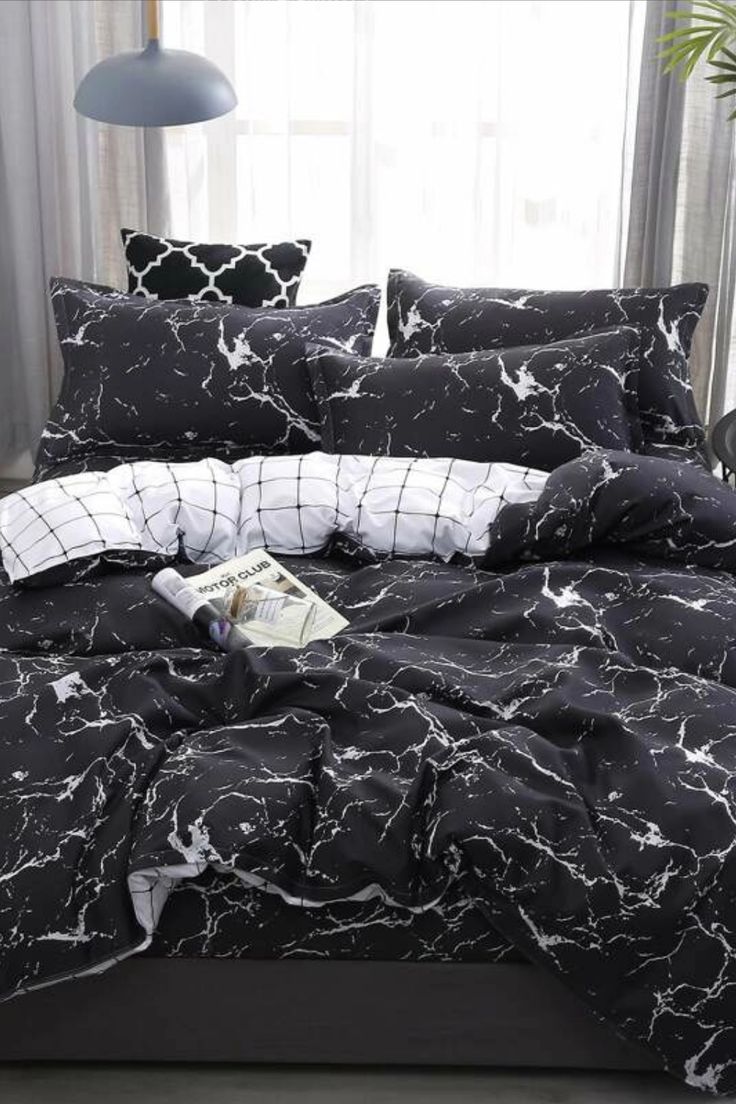 black and white bedding with an abstract design