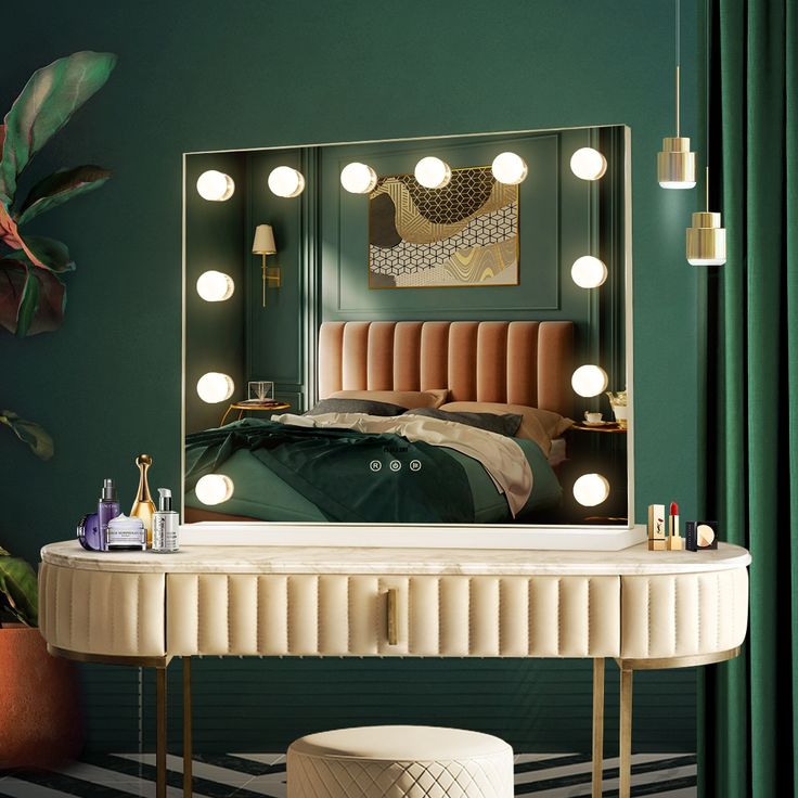 a bedroom with green walls and a large mirror on the wall over a dressing table