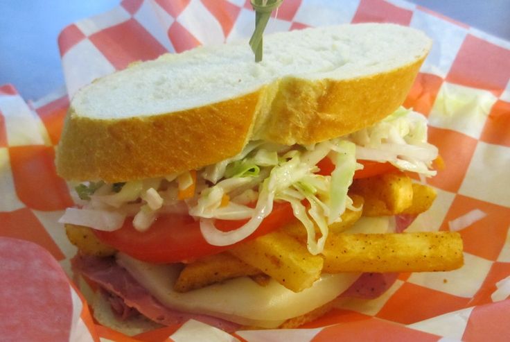 a close up of a sandwich with french fries