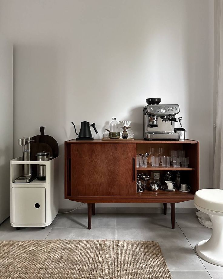 a kitchen with a coffee maker and other items on the counter