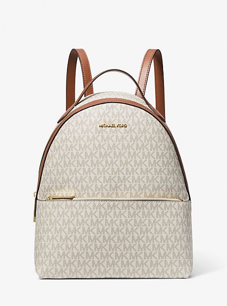 From gym sessions to city commutes, our Sheila backpack has you covered. The Signature-print canvas style comes with a dedicated pocket inside for your tablet, as well as a front zip pouch for smaller items. Adjust the buckled straps on the back for the perfect drop. Michael Kors Travel Bag, Michael Kors Backpack, Backpack Free, Medium Backpack, Shoulder Backpack, Travel School, Signature Print, Quilted Bag, Purses Michael Kors