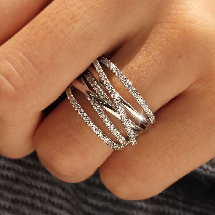 ✨💎 Wrapping your fingers boldly, Double the brilliance✨ Heavy Rhodium over Sterling Silver Top Grade 5A Cubic Zirconia Diamond Alternatives Finished with a platinum look 15,000+ customer reviews Free Shipping & Returns *Learn more Customization is welcomed 👍 Recommendations As an everyday ring As a travel wedding band ✈ As a gift for your soulmate ❤️ 💎 Features Connect!Woven by fate, everyone you hold dear are now connected.Delicately entwined design, the bands illustrate the story of crossin Criss Cross Ring, Silver Tops, Right Hand Rings, Cross Ring, Statement Ring Silver, Best Diamond, Multi Stone Ring, Cz Stone, Jewelry Trends