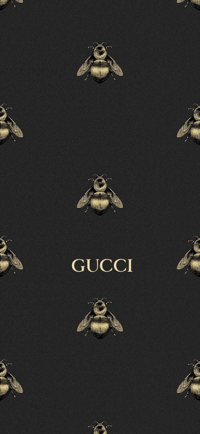 a black and gold wallpaper with bees on it