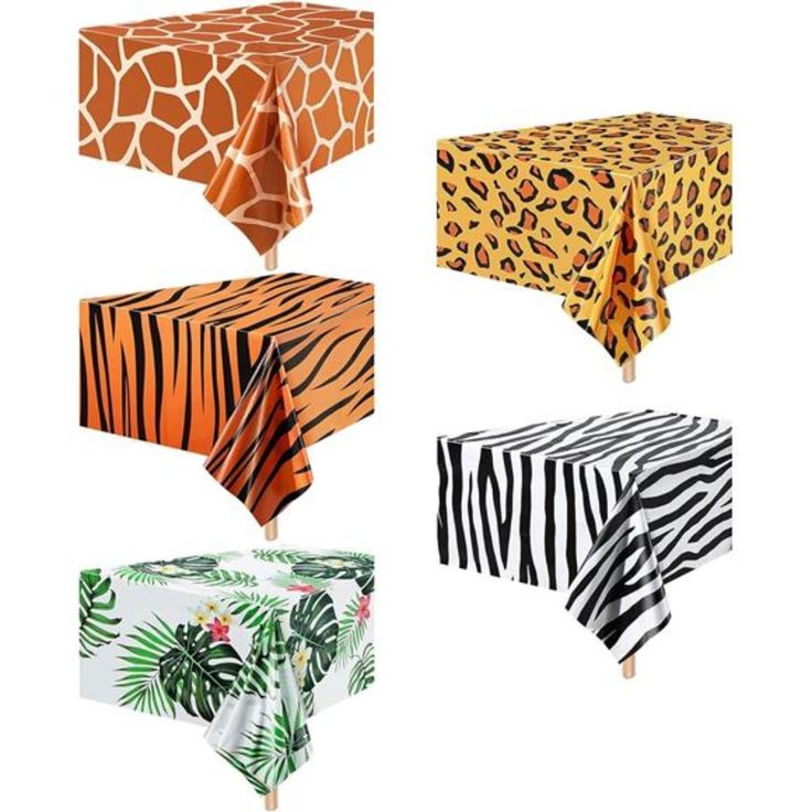 four different animal print tablecloths on top of each other