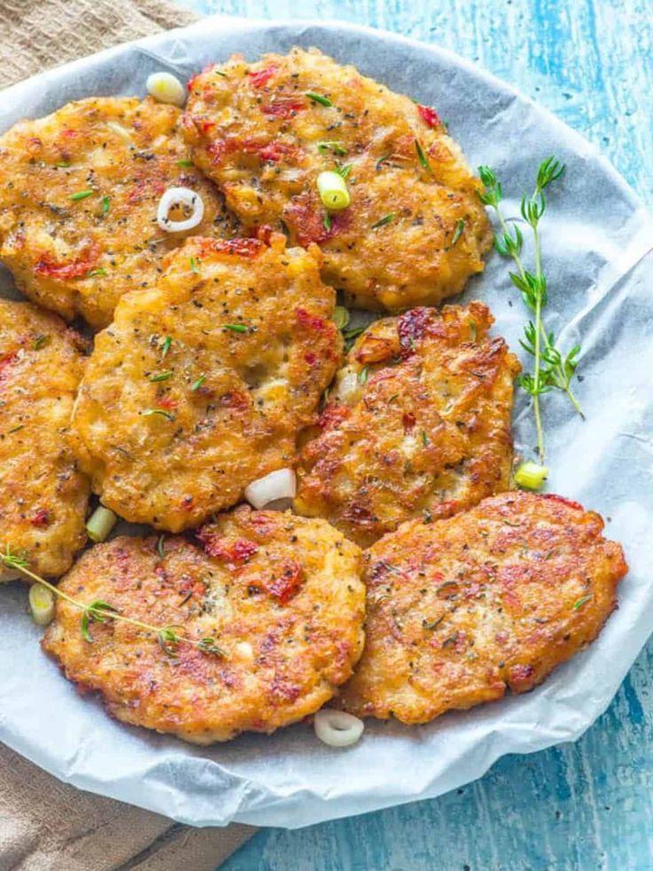 Caribbean-style Salt Fish Fritters on a baking parchment lined plate. Jamaican Fritters Recipe, Trinidad Breakfast Recipes, Saltfish Fritters Jamaican, Jamaican Fritters, Grenadian Food, West Indian Recipes, Jamaican Saltfish Fritters Recipe, Jamaican Appetizers, Longaniza Recipe