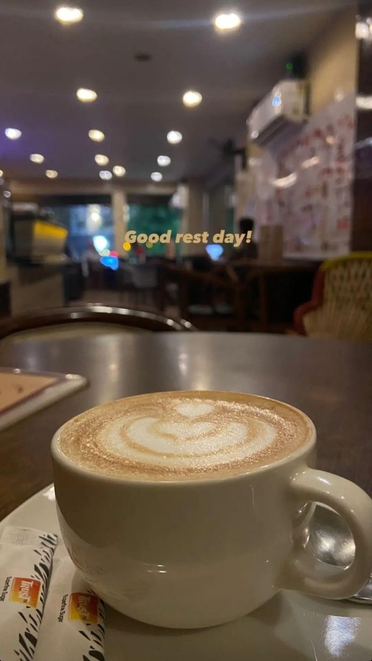 a cappuccino sits on a table in a restaurant