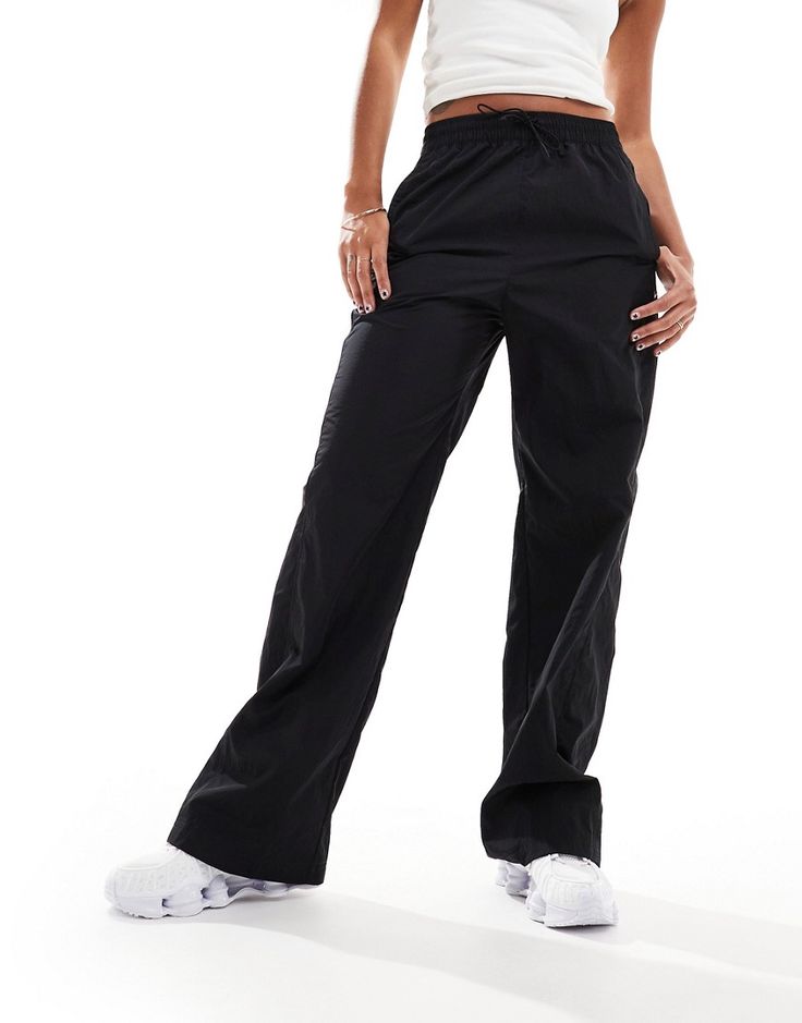 Leggings by Nike For days when denim won't do High rise Toggle waist Side pockets Logo embroidery Relaxed fit Nike Sporty Bottoms With Cargo Pockets, Sporty Drawstring Pants Full Length, Sporty Full-length Pants With Drawstring, Sporty Full-length Drawstring Pants, Relaxed Fit Workout Pants With Drawstring, Black Stretch Bottoms With Functional Drawstring, Black Drawstring Sportswear Pants, Nike Bottoms With Elastic Waistband And Relaxed Fit, Nike Relaxed Fit Bottoms With Elastic Waistband