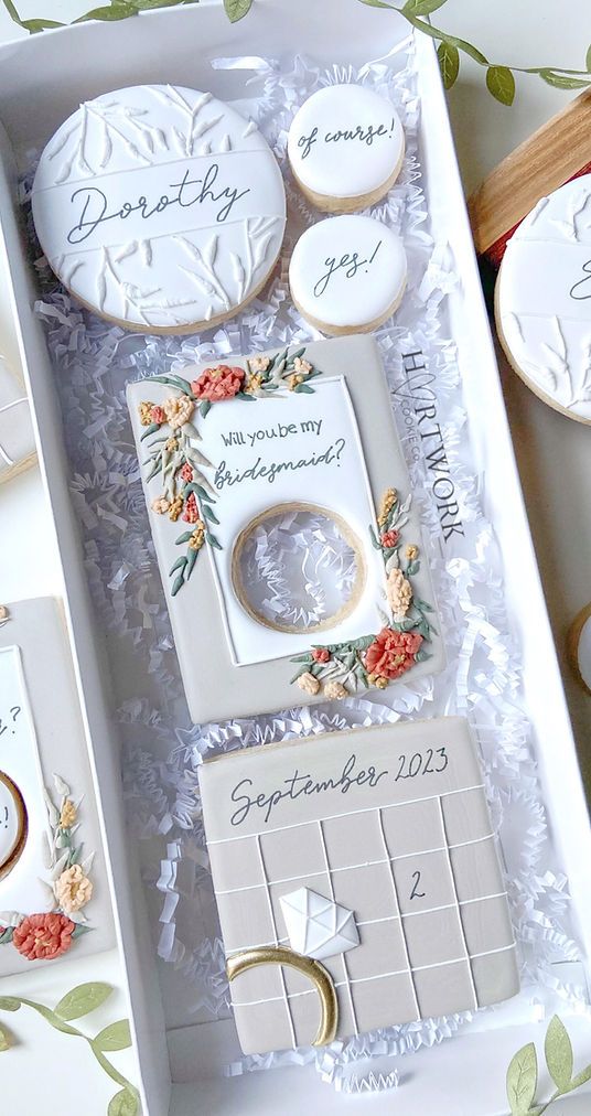 a box filled with cookies and wedding rings