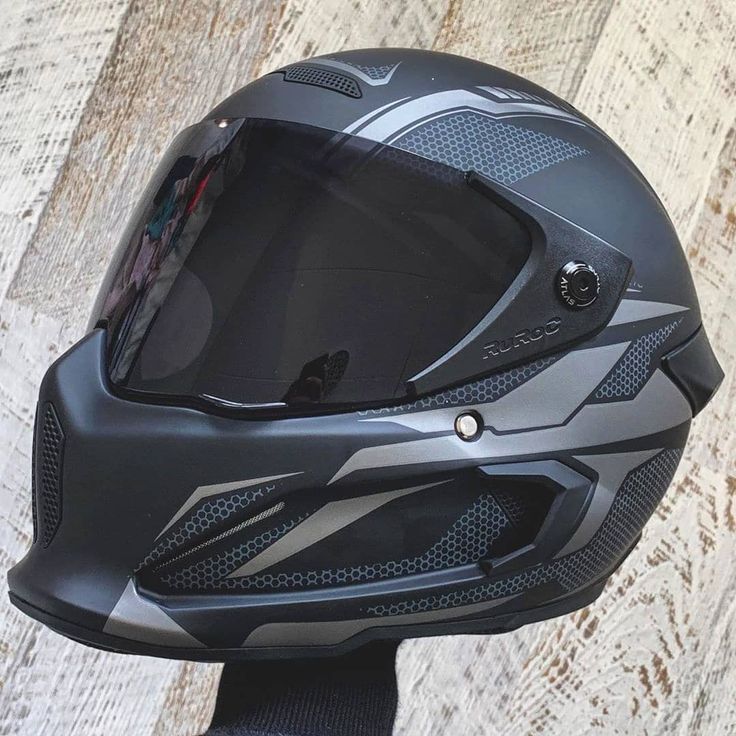 a motorcycle helmet on top of a wooden table