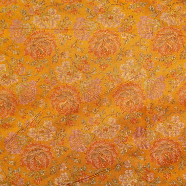 an orange and yellow floral print fabric