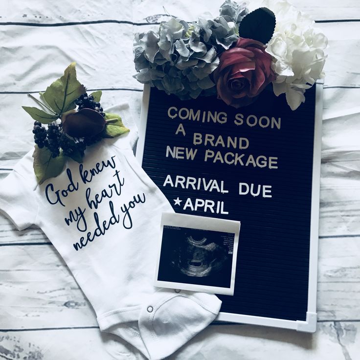 a sign that says coming soon, a brand new package and some flowers