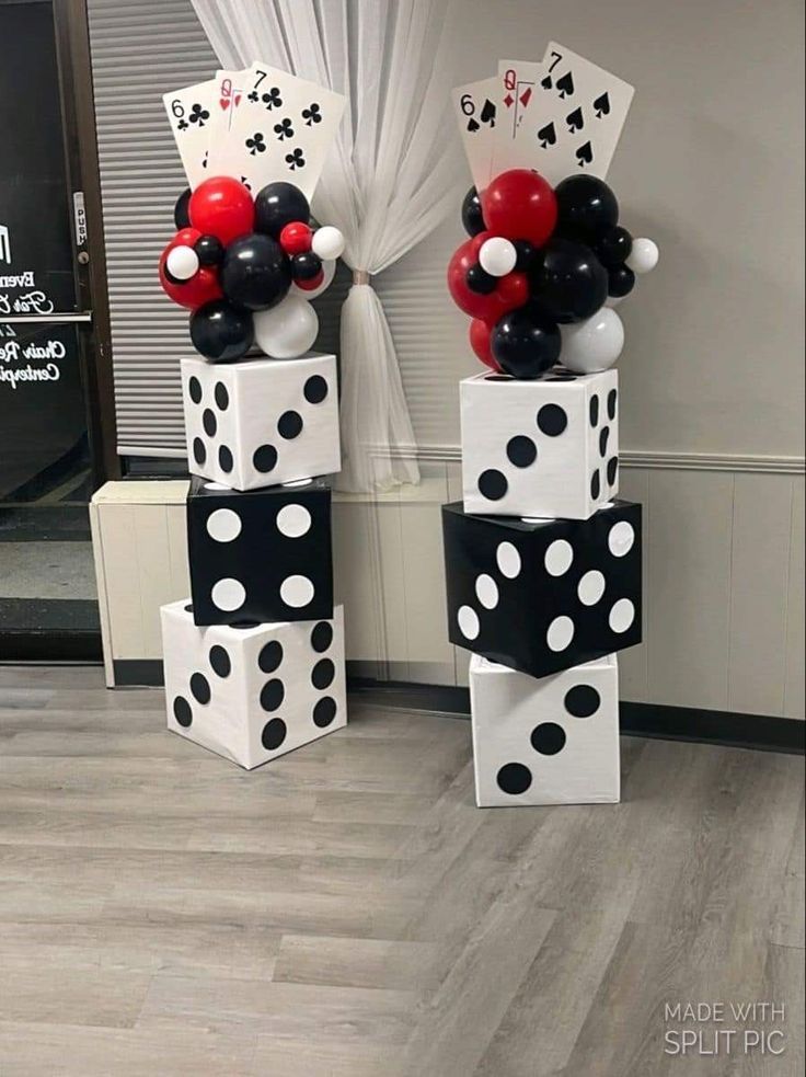 some black and white polka dot balloons are stacked on top of each other