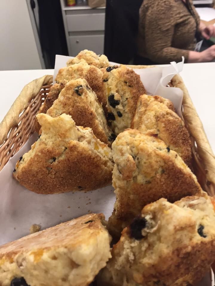 a basket filled with muffins sitting on top of a table