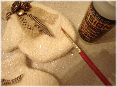 a close up of a towel with a paintbrush on it and an object in the background