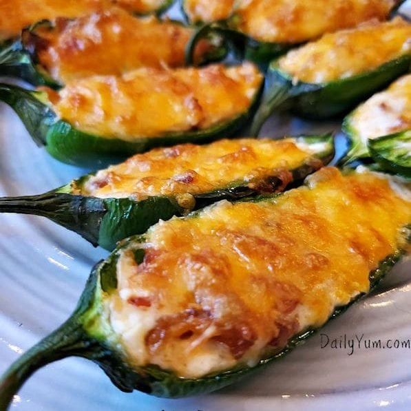 several stuffed peppers on a white plate