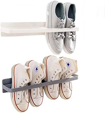 three pairs of tennis shoes are hanging on a rack