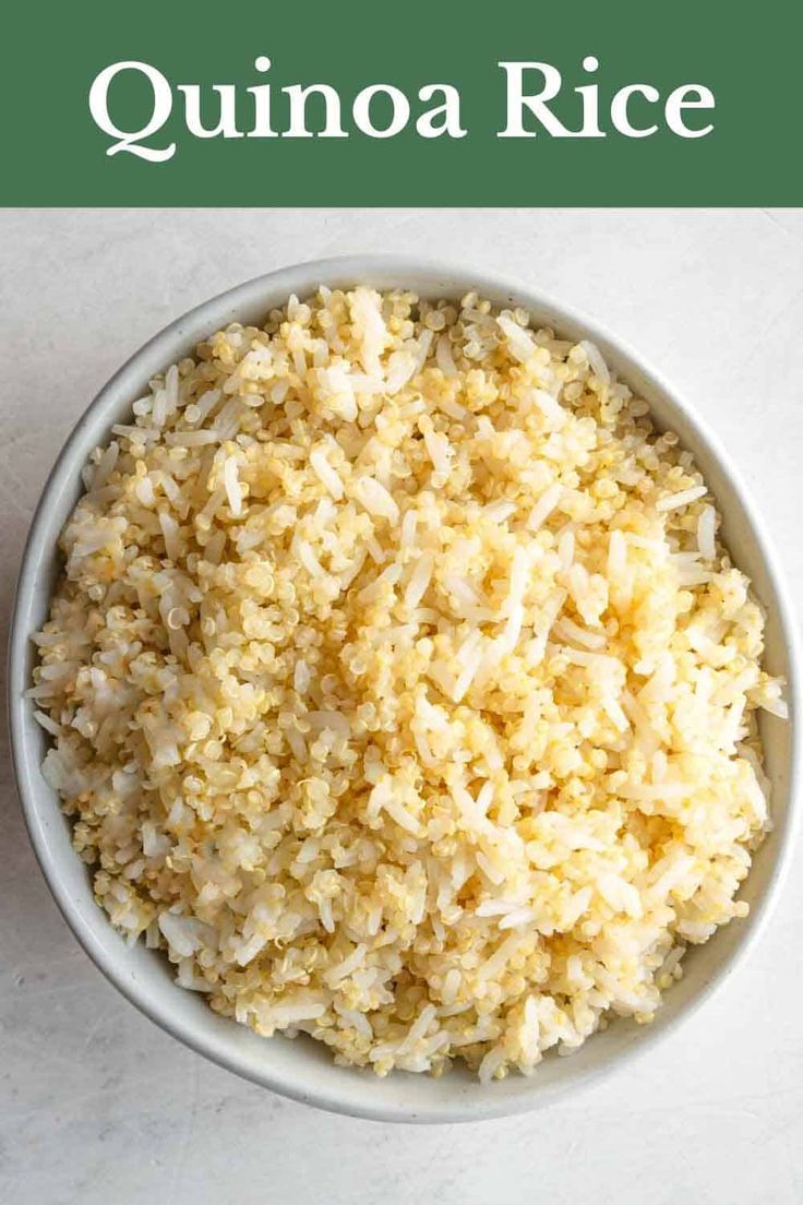 a white bowl filled with rice on top of a table next to a green sign that says quinoa rice