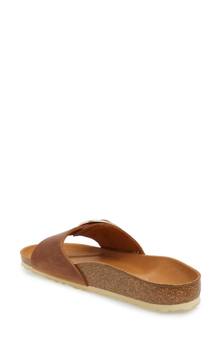 An oversized buckle cinches the angled bridge strap of a sandal built on the legendary Birkenstock footbed for time-tested comfort and on-trend style. The EVA-cushioned footbed absorbs shock and mimics the shape of a healthy foot, while pronounced medial and metatarsal arches support the instep and ball of your foot. Style Name:Birkenstock Madrid Big Buckle Slide Sandal (Women). Style Number: 6135859. Classic Slide Sandals With Cushioned Footbed, Classic Slide Footbed Sandals With Cushioned Footbed, Classic Brown Footbed Sandals For Summer, Classic Cushioned Slide Footbed Sandals, Brown Slide Footbed Sandals With Removable Insole, Brown Slides With Cushioned Footbed, Brown Closed Toe Footbed Sandals With Textured Footbed, Casual Footbed Sandals With Leather Sole And Toe Loop, Closed Toe Brown Footbed Sandals With Textured Footbed