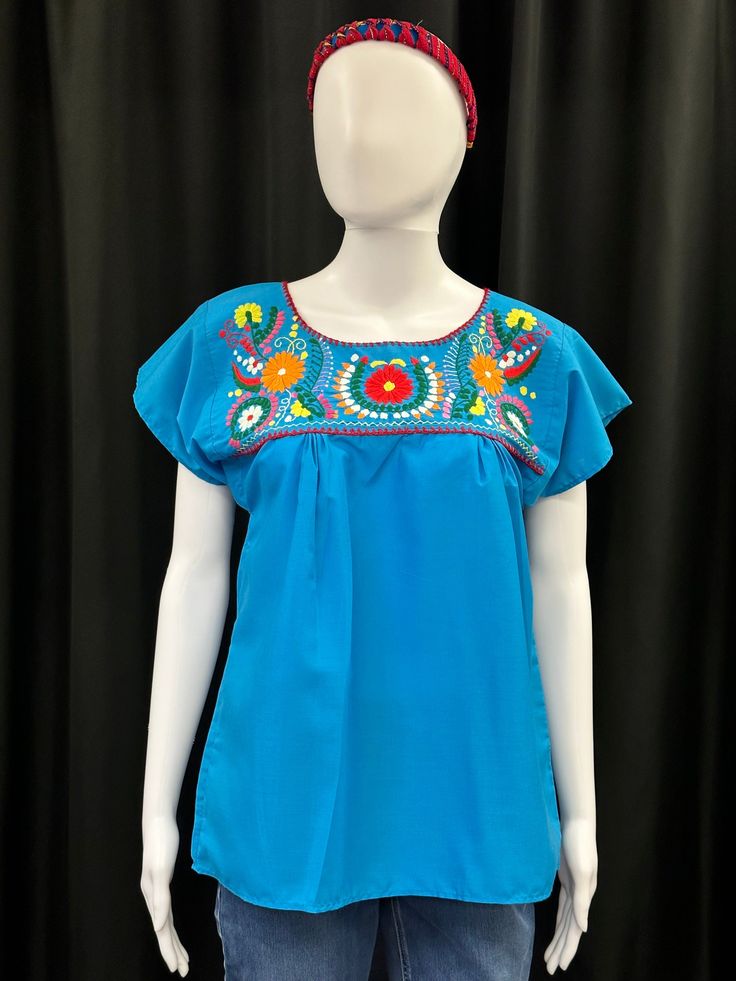 Beautiful embroidered Mexican top for special ocassions or daily wear. Crew Neck Blouse With Floral Embroidery, Spring Cotton Embroidered Sleeve Top, Fitted Floral Embroidery Crew Neck Top, Multicolor Embroidered Sleeves Tops, Casual Crew Neck Top With Embroidered Sleeves, Spring Cotton Tops With Embroidered Hem, Blue Casual Top With Floral Embroidery, Casual Tops With Embroidered Sleeves For Festival, Blue Tops With Geometric Embroidery For Spring