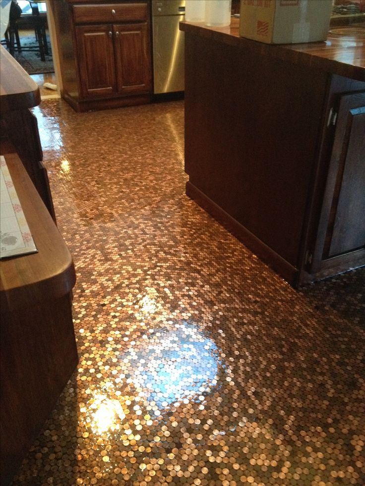 the kitchen floor is covered in gold coins