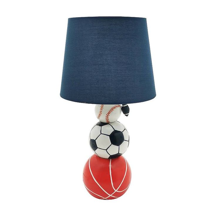 a lamp that is sitting on top of a ball with a soccer ball on it