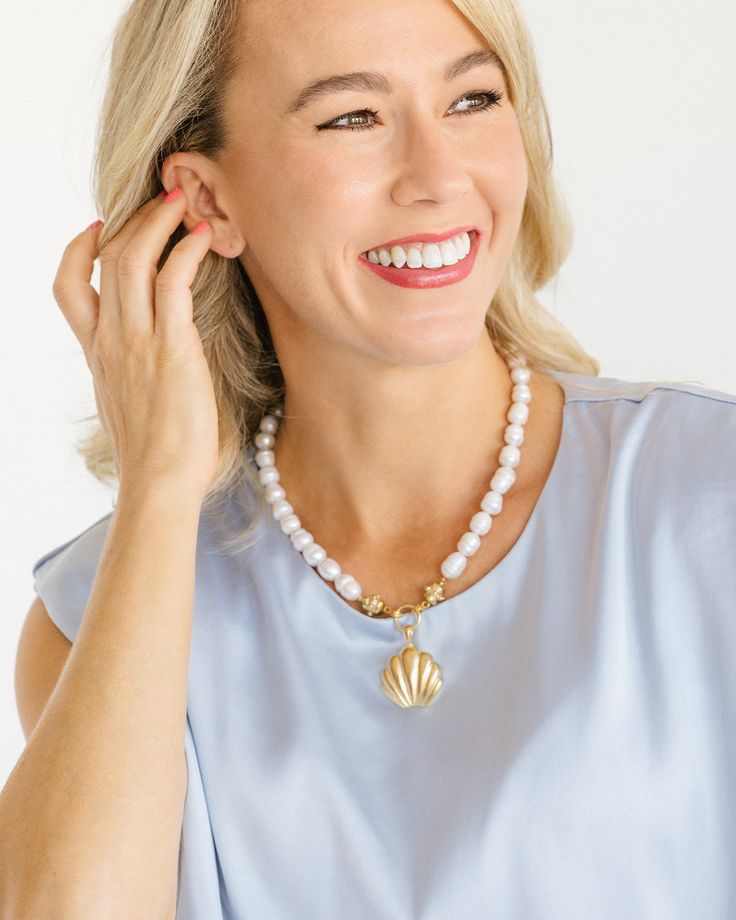 Our Marbella Pearl Necklace is the epitome of classy and timeless style. Connected to the pendant by our signature Bentley Beads, freshwater pearls give this piece an heirloom feel. Wear it as an accessory to your beachside ensemble with our Marbella Studs or as the perfect piece to complement your happy hour mini dress. Elegant Shell-shaped Pearl Drop Necklace, Elegant Pearl White Jewelry For Beach, Pearl White Shell-shaped Pearl Chain Jewelry, Elegant Pearl Charm Shell Necklace For Beach, Pearl White Shell Pearl Necklace With Pendant, Pearl White Shell-shaped Necklace With Pearl Pendant, Elegant Shell Pearl Drop Necklace, Shell-shaped Pearl Drop Necklace, Pearl Drop Shell Pearl Necklace