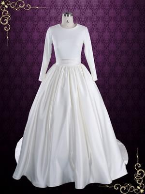 a white wedding dress on display in front of a purple background