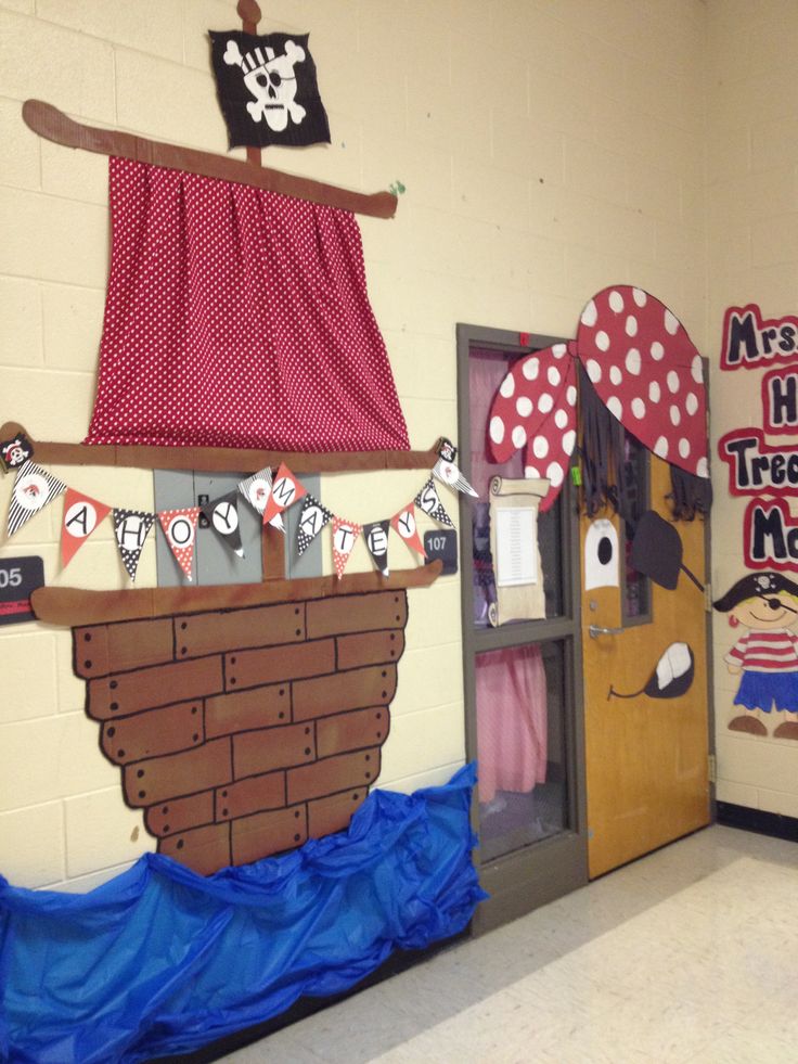 a classroom door decorated with pirate decorations and paper cutouts on the front, along with an image of a ship