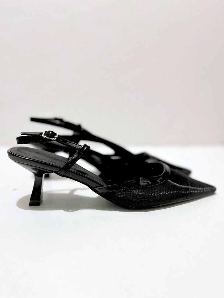 A staple to our capsule collections, these black close-toe kitten heels are perfect for you! They're so cute, stylish and comfortable that it's impossible to feel confident walking in these low-heeled shoes. Best of all, these heels are timeless - always in style. Pair them with a classy bodycon dress for a feminine chic office look or pair them with a blouse and jeans for a feminine causal look.     Why You'll Love These Black Kitten Heels      Low Heel, Pointed Toe : We get it, not everyone lo Chic Medium Width Pointed Toe Kitten Heels, Black Low Heel Kitten Heels For Evening, Chic Closed Toe Kitten Heels With Heel Strap, Chic Almond Toe Kitten Heels With Medium Width, Trendy Leather Kitten Heels With Sculpted Heel, Chic Kitten Heels With Padded Heel And Almond Toe, Chic Kitten Heels With Round Toe, Chic Black Kitten Heels For Evening, Black Almond Toe Kitten Heels For Summer