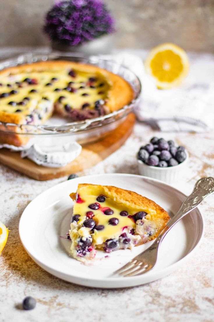 a slice of blueberry pie on a white plate