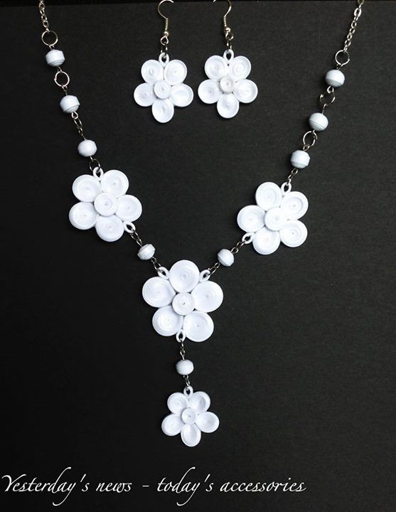 a white flower necklace and earring set on a black background with the words jewelry news today's accessories