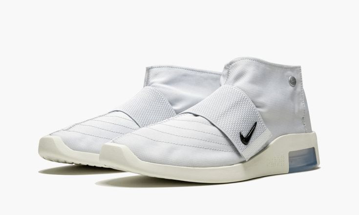 The Nike Air Fear of God Moccasin “Pure Platinum” is the debut colorway of the high-fashion inspired sneaker by Jerry Lorenzo.  The Air Fear of God Moc features a sporty and fashionable take on the traditional moccasin design that delivers a laid-back look and feel.  The model is constructed with a full ripstop nylon upper in Pure Platinum with a Sail hue on the sculpted midsole.  The upper features a midfoot strap and a toggle rope at the heel for a custom fit.  The Fear of God Moccasin also ha Nike Air Fear Of God, Jerry Lorenzo, Nike Casual, Platinum Grey, Baskets Nike, Stadium Goods, Fear Of God, The Fear, Mens Sportswear