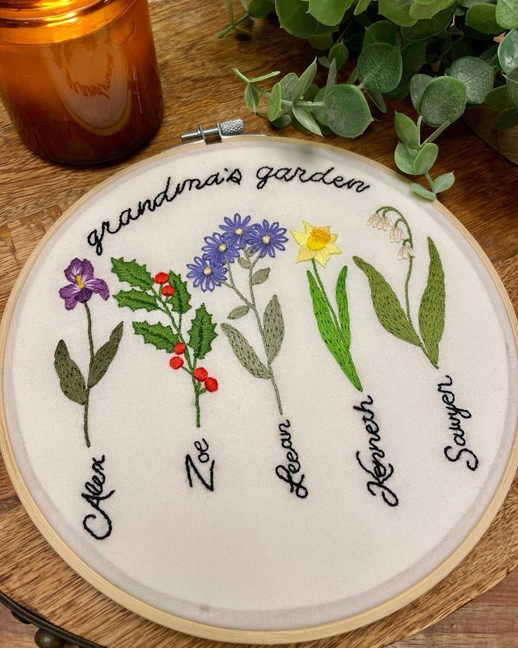 a cross stitch pattern with flowers and the words grandma's garden written on it